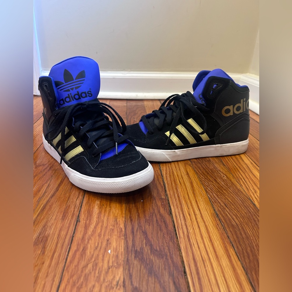 adidas Hoops
Purple & Black High-Top Sneakers with Gold Stripes
